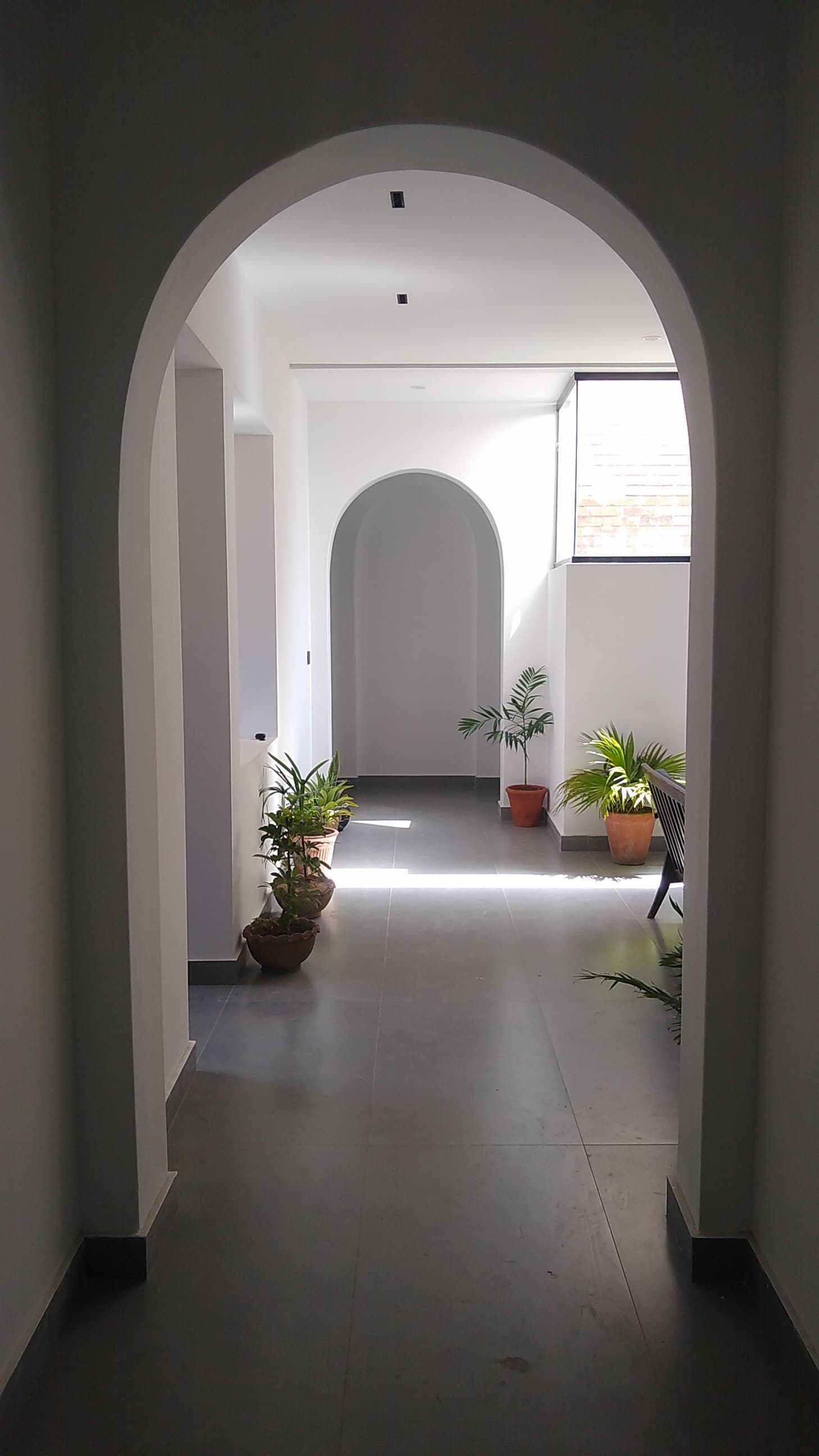Modern arched hallway with natural light